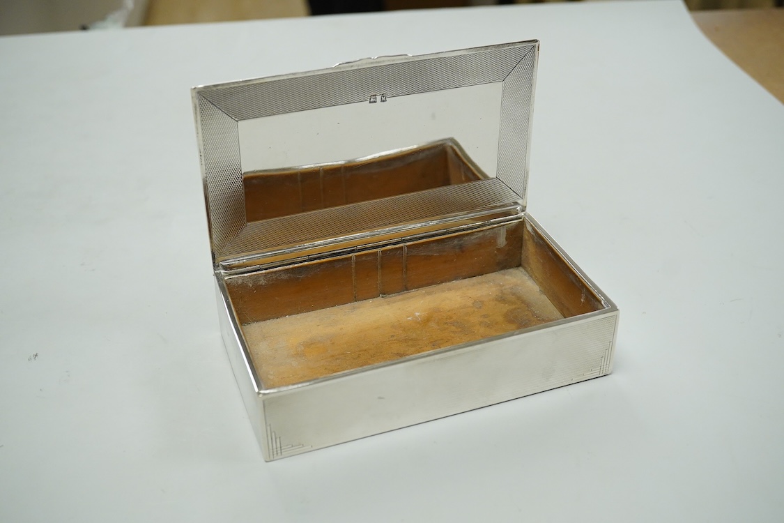 A George VI engine turned silver mounted rectangular cigarette box, by John Rose, Birmingham, 1936, 14.2cm.